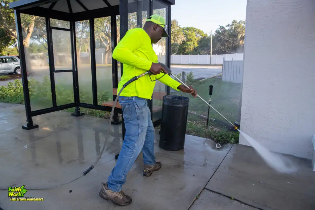 Pressure washing technician cleaning for Faithworks in Central Florida.