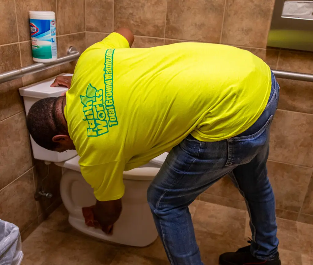 Janitorial services crew cleaning commercial bathroom