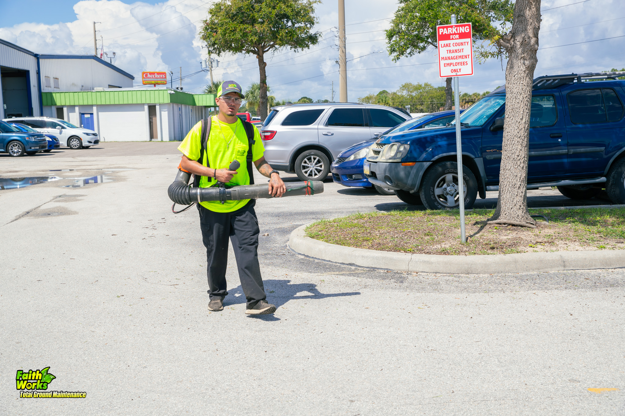 Faithworks employee providing commercial landscaping and grounds maintenance in Palatka Florida